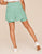 Adore Me Selina 2in1 Short Two Layer Active Short with Pockets in color Green Come True (Walkpop_Green Come True) and shape short